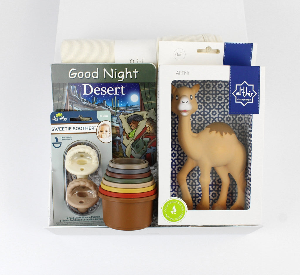 Desert themed baby gift . Featuring a camel teether, a blanket, a board book ,pacifier and stacking cups.
