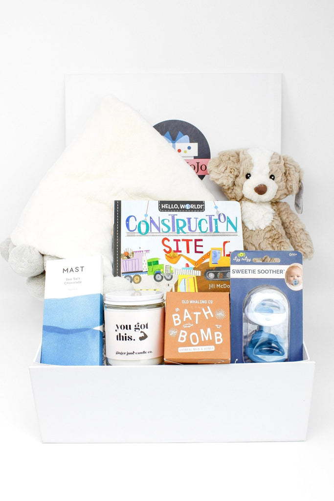 A baby gift box for a newborn to age 1 year. Contains a blanket ,plush, book and treats for the new parents.