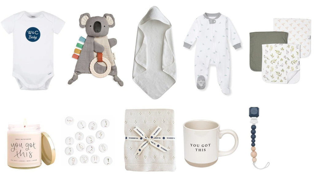 Collection of baby items including onesies, a koala toy, and mugs on a white background